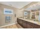 Double vanity bathroom with granite countertops at 1 Calm Ct, Placida, FL 33946