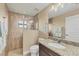 Bathroom with shower and granite vanity at 1 Calm Ct, Placida, FL 33946