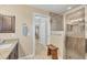 Bathroom with walk-in shower and granite vanity at 1 Calm Ct, Placida, FL 33946