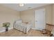 Small bedroom with daybed and rocking chair at 1 Calm Ct, Placida, FL 33946