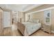 Light and bright bedroom with a wooden bed frame at 1 Calm Ct, Placida, FL 33946