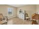 Bright home office features built-in shelving, hardwood floors, and a window with plantation shutters at 1 Calm Ct, Placida, FL 33946