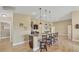 Kitchen island with granite countertops and dark wood cabinets at 1 Calm Ct, Placida, FL 33946