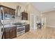 Kitchen with stainless steel appliances and mosaic backsplash at 1 Calm Ct, Placida, FL 33946