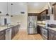 Stainless steel appliances and granite countertops in kitchen at 1 Calm Ct, Placida, FL 33946