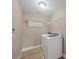 Laundry room with washer, dryer, and overhead shelving at 1 Calm Ct, Placida, FL 33946