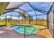 Relaxing screened pool and spa with tranquil backyard views at 1 Calm Ct, Placida, FL 33946