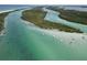 Aerial view of a calm waterway with many boats anchored near the shoreline at 10451 Sherman St, Englewood, FL 34224