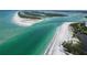 Aerial view of a stunning beach and waterway, perfect for a relaxing getaway at 10451 Sherman St, Englewood, FL 34224