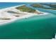 Aerial view showcasing waterfront property with private beach access and boat passage at 10451 Sherman St, Englewood, FL 34224