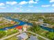 Bird's-eye view of a waterfront community showcasing canal views at 10544 Poughkeepsie Cir, Port Charlotte, FL 33981