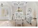 Formal dining room with white table and chandelier at 10544 Poughkeepsie Cir, Port Charlotte, FL 33981