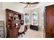 Spacious home office with built-in wooden desk and window seat at 10544 Poughkeepsie Cir, Port Charlotte, FL 33981