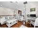 Living room with sofas, coffee table, and home office at 10544 Poughkeepsie Cir, Port Charlotte, FL 33981