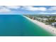 Breathtaking aerial view of the coastline and clear turquoise waters at 1100 Gulf Blvd, Englewood, FL 34223