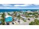 Beautiful beach neighborhood featuring a mix of colorful homes, palm trees, and ocean views at 1100 Gulf Blvd, Englewood, FL 34223