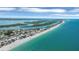 Scenic aerial view of beachfront homes along the pristine shoreline at 1100 Gulf Blvd, Englewood, FL 34223