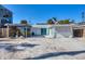 Inviting backyard patio with pergola offers shade and space for outdoor dining and relaxation at 1100 Gulf Blvd, Englewood, FL 34223