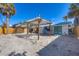 Backyard featuring a new pergola, wooden fence, and new turquoise door at 1100 Gulf Blvd, Englewood, FL 34223