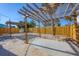 Backyard features a wooden pergola and newly installed privacy fence at 1100 Gulf Blvd, Englewood, FL 34223