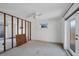 Spacious living area with ceiling fan, doors and exposed wall framing, ready for renovation at 1100 Gulf Blvd, Englewood, FL 34223