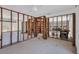 Large, open living area undergoing renovation with exposed framing at 1100 Gulf Blvd, Englewood, FL 34223