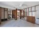 Spacious Living Room featuring exposed framing and ceiling fan, undergoing renovation at 1100 Gulf Blvd, Englewood, FL 34223