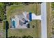 Directly above view of house, pool, and driveway at 12075 Duval Blvd, Port Charlotte, FL 33981