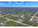 Aerial view showing home's location in a residential neighborhood at 12075 Duval Blvd, Port Charlotte, FL 33981