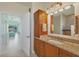 Bathroom with double sink vanity and view of bedroom at 12075 Duval Blvd, Port Charlotte, FL 33981