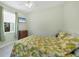 Bedroom with a queen-size bed and light-green walls at 12075 Duval Blvd, Port Charlotte, FL 33981