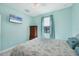 Bedroom with a queen-size bed, dresser, and light-blue walls at 12075 Duval Blvd, Port Charlotte, FL 33981