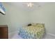 Bedroom with a queen-size bed and light-green walls at 12075 Duval Blvd, Port Charlotte, FL 33981