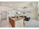 Kitchen with breakfast bar and view of living room at 12075 Duval Blvd, Port Charlotte, FL 33981