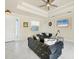 Open concept living room with tiled floors, neutral walls, and comfortable seating at 12075 Duval Blvd, Port Charlotte, FL 33981