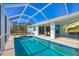 Relaxing screened pool and patio with seating area and pool access at 12075 Duval Blvd, Port Charlotte, FL 33981