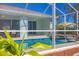 Step into paradise; view of a refreshing pool from the lanai at 12075 Duval Blvd, Port Charlotte, FL 33981