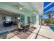 Indoor/outdoor living; this patio connects the home to the pool at 12075 Duval Blvd, Port Charlotte, FL 33981