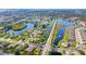 Wide aerial view showcasing the home's location in a community at 12650 Montigello Ct, Englewood, FL 34223