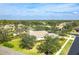 Aerial view of single-Gathering home with pool and lush landscaping at 12650 Montigello Ct, Englewood, FL 34223