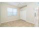 Bedroom with tile flooring and a double door closet at 12650 Montigello Ct, Englewood, FL 34223