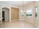 Bright breakfast nook with tile flooring and a decorative wall at 12650 Montigello Ct, Englewood, FL 34223