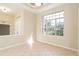 Bright dining room with large window and tile floor at 12650 Montigello Ct, Englewood, FL 34223