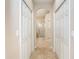 Hallway with tile flooring and built-in storage at 12650 Montigello Ct, Englewood, FL 34223