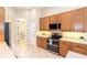 Well-equipped kitchen, featuring stainless steel appliances at 12650 Montigello Ct, Englewood, FL 34223