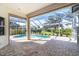 Relaxing pool area with covered patio and lush landscaping at 12650 Montigello Ct, Englewood, FL 34223