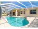 Private pool and screened enclosure with a large patio at 12650 Montigello Ct, Englewood, FL 34223