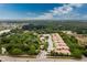 Aerial view of condo community near a lake at 129 Preserve Pl # A, Nokomis, FL 34275