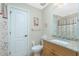 Bathroom with granite countertop and floral shower curtain at 129 Preserve Pl # A, Nokomis, FL 34275