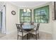 Cozy breakfast nook with a small round table and four chairs, ideal for casual dining at 129 Preserve Pl # A, Nokomis, FL 34275